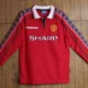 The 1998 Manchester United home long sleeve retro soccer jersey is a classic piece of football memorabilia. This jersey is notable for its distinctive red color and