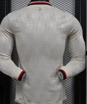 The Bayern Munich Third Long Sleeve Player Version Jersey for the 2024-2025 season typically features the club's distinctive colors and design elements, tailored for player comfort and performance. The jersey is made from high-quality moisture-wicking fabric, ensuring breathability and a comfortable fit during play. ### Key Features: - **Design**: The jersey usually incorporates the club’s traditional color scheme, along with unique graphics and patterns specific to the third kit. - **Fit**: Player version jerseys are designed with a tighter fit, mirroring the style worn by the professionals on the field. - **Materials**: High-performance fabrics that provide durability, stretch, and moisture management. - **Badges and Logos**: Includes the official Bayern Munich crest, the Adidas logo, and any sponsor logos, all appropriately embroidered or printed. - **Sleeves**: Long sleeves provide additional coverage and warmth, making it suitable for various weather conditions. - **Customization**: Many retailers offer options for customization, where fans can add a player’s name and number. If you're looking to purchase or learn more, make sure to check official Bayern Munich stores or authorized retailers for authenticity and the latest designs.