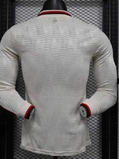 The Bayern Munich Third Long Sleeve Player Version Jersey for the 2024-2025 season typically features the club's distinctive colors and design elements, tailored for player comfort and performance. The jersey is made from high-quality moisture-wicking fabric, ensuring breathability and a comfortable fit during play. ### Key Features: - **Design**: The jersey usually incorporates the club’s traditional color scheme, along with unique graphics and patterns specific to the third kit. - **Fit**: Player version jerseys are designed with a tighter fit, mirroring the style worn by the professionals on the field. - **Materials**: High-performance fabrics that provide durability, stretch, and moisture management. - **Badges and Logos**: Includes the official Bayern Munich crest, the Adidas logo, and any sponsor logos, all appropriately embroidered or printed. - **Sleeves**: Long sleeves provide additional coverage and warmth, making it suitable for various weather conditions. - **Customization**: Many retailers offer options for customization, where fans can add a player’s name and number. If you're looking to purchase or learn more, make sure to check official Bayern Munich stores or authorized retailers for authenticity and the latest designs.