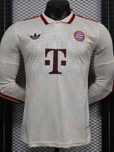 The Bayern Munich Third Long Sleeve Player Version Jersey for the 2024-2025 season typically features the club's distinctive colors and design elements, tailored for player comfort and performance. The jersey is made from high-quality moisture-wicking fabric, ensuring breathability and a comfortable fit during play. ### Key Features: - **Design**: The jersey usually incorporates the club’s traditional color scheme, along with unique graphics and patterns specific to the third kit. - **Fit**: Player version jerseys are designed with a tighter fit, mirroring the style worn by the professionals on the field. - **Materials**: High-performance fabrics that provide durability, stretch, and moisture management. - **Badges and Logos**: Includes the official Bayern Munich crest, the Adidas logo, and any sponsor logos, all appropriately embroidered or printed. - **Sleeves**: Long sleeves provide additional coverage and warmth, making it suitable for various weather conditions. - **Customization**: Many retailers offer options for customization, where fans can add a player’s name and number. If you're looking to purchase or learn more, make sure to check official Bayern Munich stores or authorized retailers for authenticity and the latest designs.